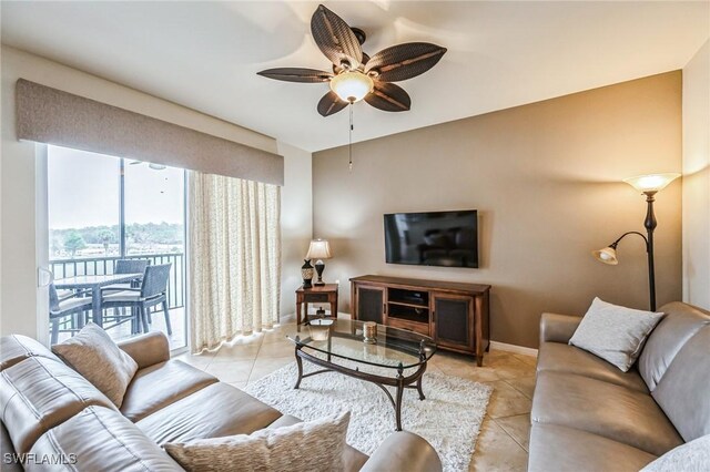 living room with light tile patterned flooring and ceiling fan