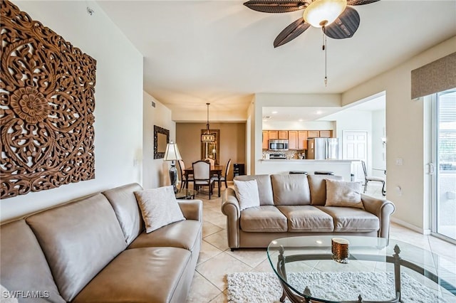 tiled living room featuring ceiling fan