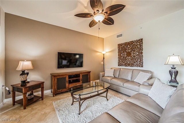 living room with light tile patterned floors and ceiling fan