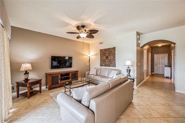 tiled living room featuring ceiling fan