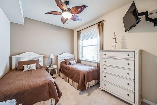 bedroom with light colored carpet and ceiling fan