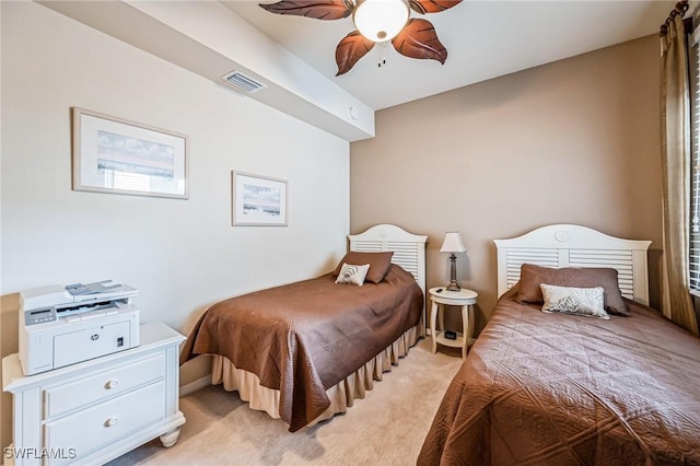 bedroom featuring light colored carpet and ceiling fan