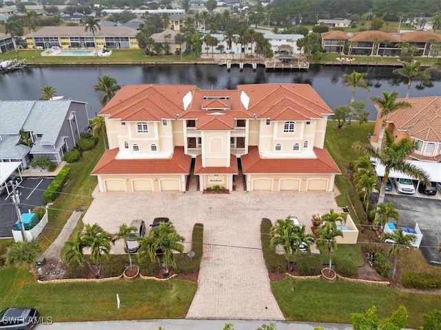 birds eye view of property featuring a water view