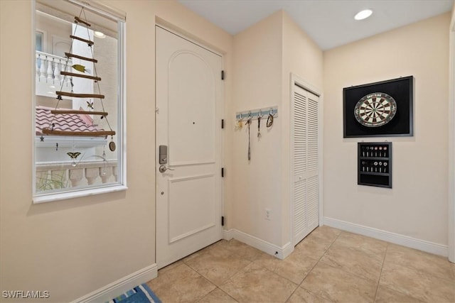 tiled foyer with plenty of natural light