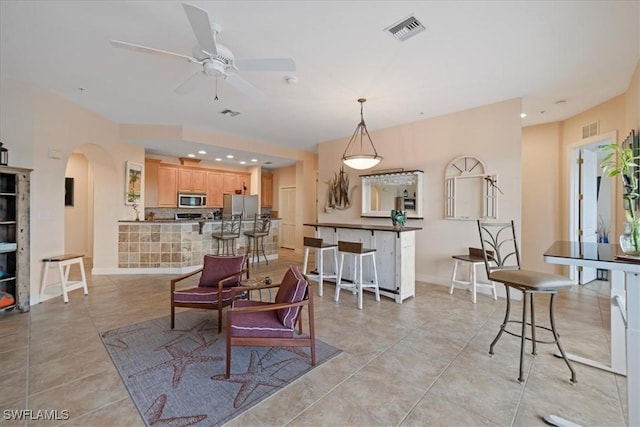 interior space featuring ceiling fan and light tile patterned flooring