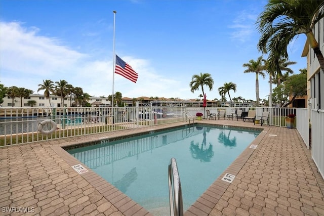 view of pool featuring a patio