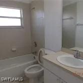 full bathroom with toilet, shower / bath combination, and vanity