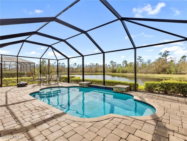 view of pool featuring a patio area, a lanai, and a water view