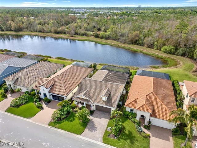 birds eye view of property with a water view