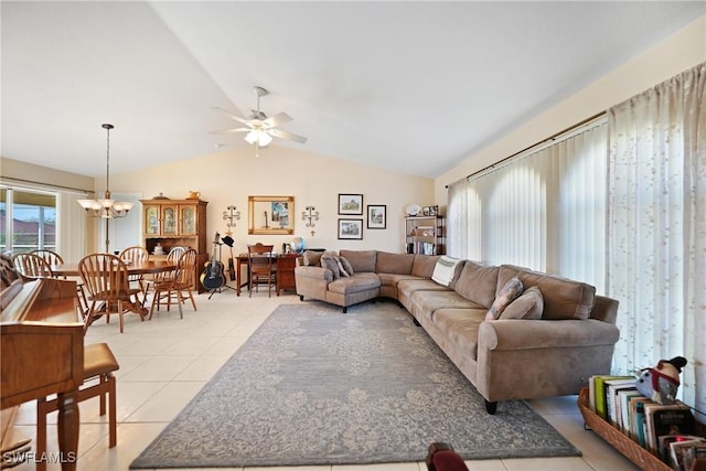 tiled living room featuring ceiling fan with notable chandelier and vaulted ceiling