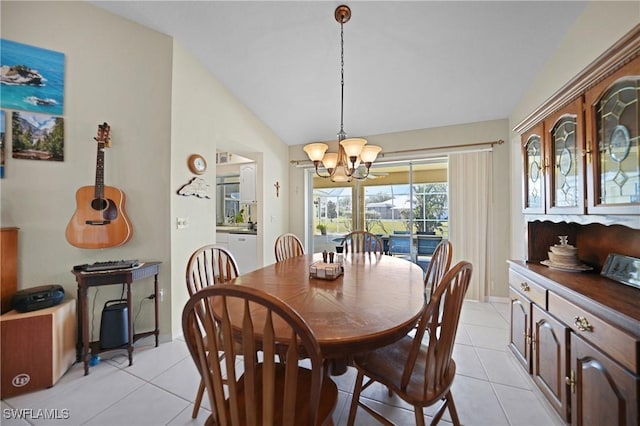 tiled dining room featuring lofted ceiling and an inviting chandelier