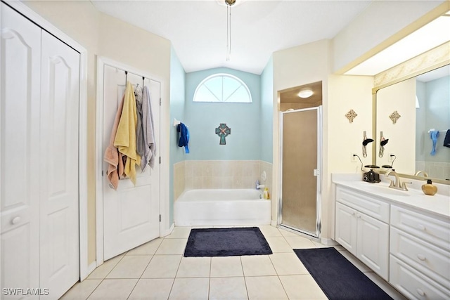 bathroom with tile patterned flooring, vanity, lofted ceiling, and plus walk in shower