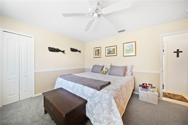 bedroom featuring ceiling fan, carpet flooring, and a closet