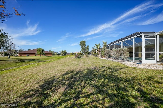 view of yard with a lanai