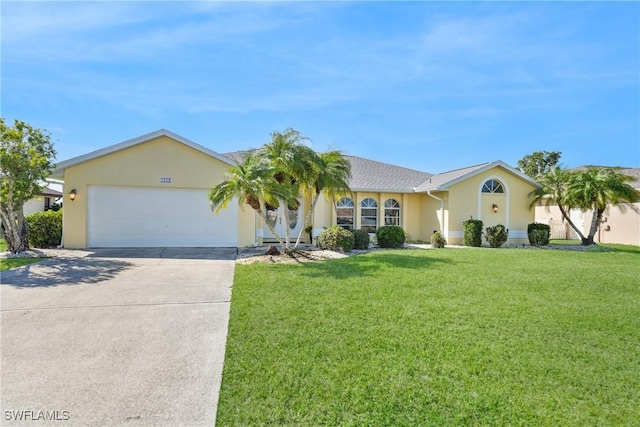 single story home with a garage and a front yard