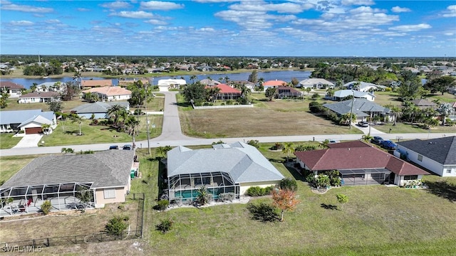 drone / aerial view with a water view