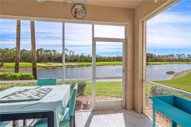 sunroom with a water view