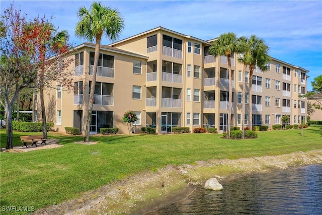 view of building exterior with a water view