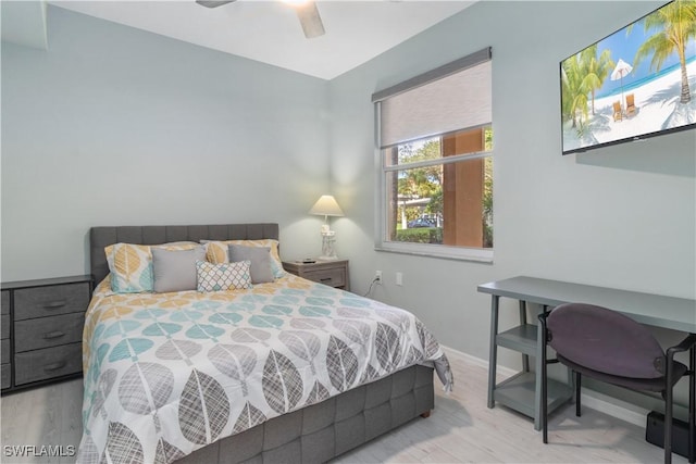 bedroom with ceiling fan and wood-type flooring