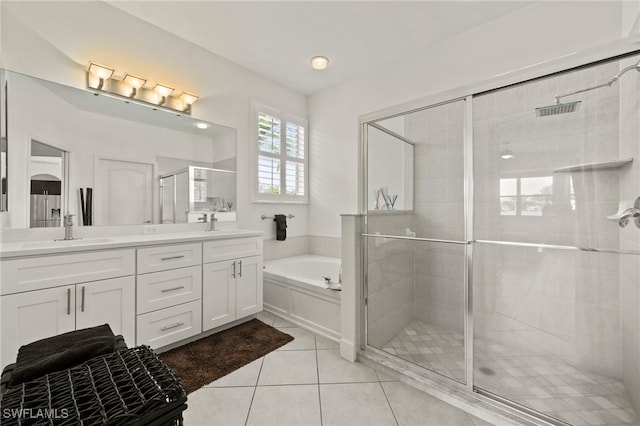 bathroom with tile patterned flooring, vanity, and independent shower and bath