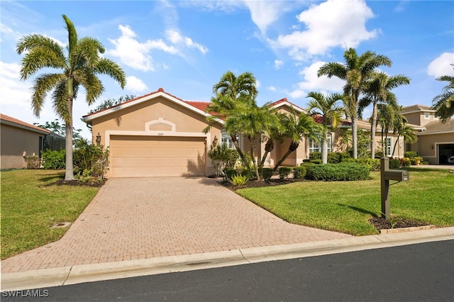 view of front of house featuring a garage and a front yard