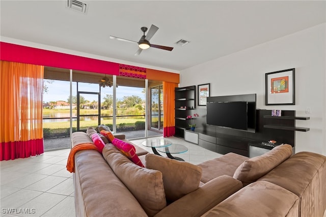 tiled living room featuring ceiling fan