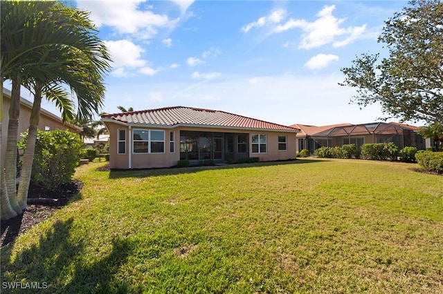 back of house with a yard