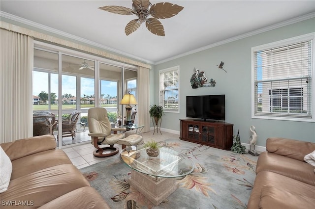 tiled living room with ceiling fan and crown molding