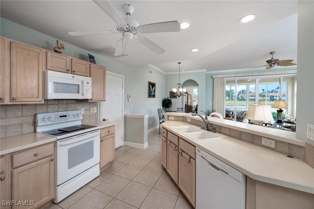 kitchen with tasteful backsplash, sink, white appliances, light tile patterned flooring, and light brown cabinetry