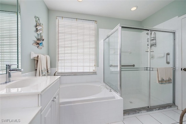 bathroom featuring vanity, tile patterned floors, and shower with separate bathtub