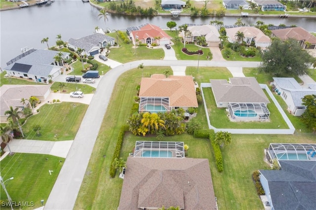 birds eye view of property with a water view