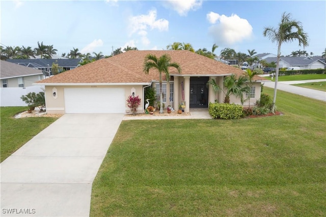 single story home featuring a garage and a front lawn