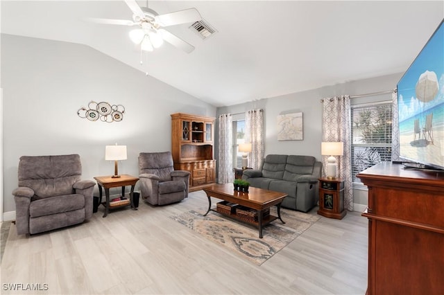 living room featuring ceiling fan, light hardwood / wood-style floors, and lofted ceiling