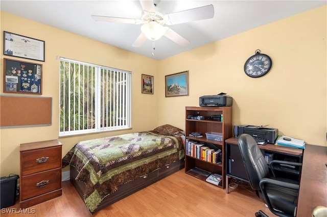 bedroom featuring light hardwood / wood-style flooring and ceiling fan