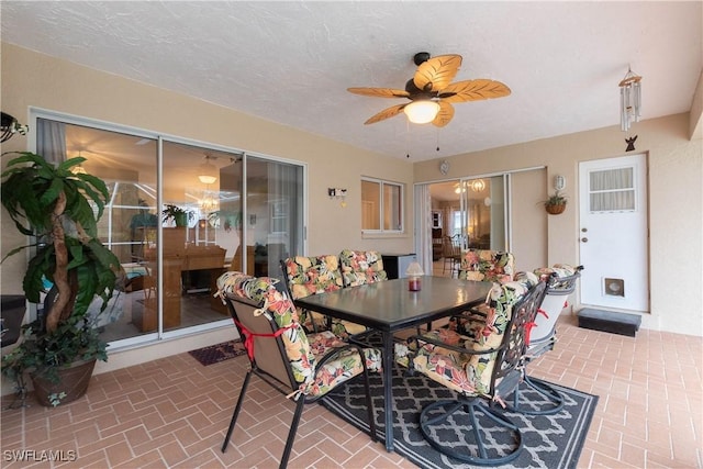 interior space with ceiling fan