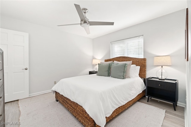 bedroom with light wood-type flooring and ceiling fan