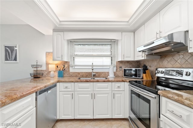 kitchen featuring light tile patterned flooring, sink, light stone counters, stainless steel appliances, and white cabinets