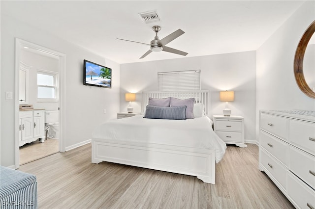 bedroom with connected bathroom, ceiling fan, and light hardwood / wood-style floors