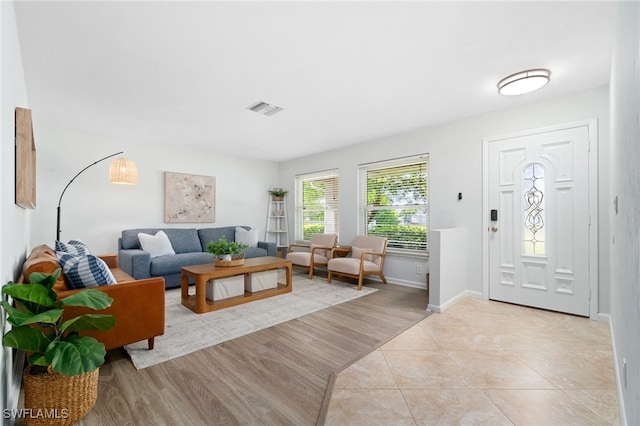 foyer entrance featuring light tile patterned floors