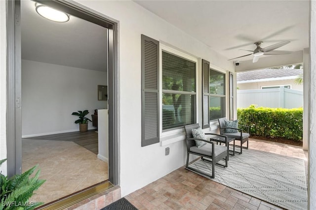 view of patio / terrace featuring ceiling fan