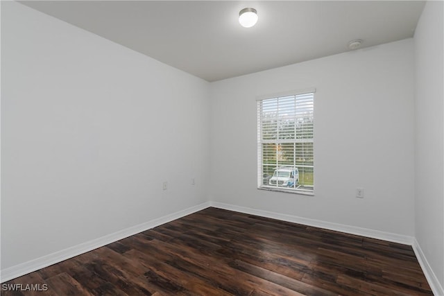 empty room featuring dark wood-type flooring