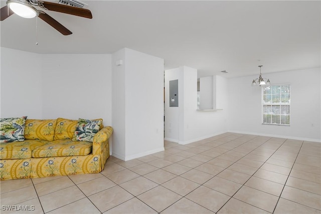 tiled living room with electric panel and ceiling fan with notable chandelier