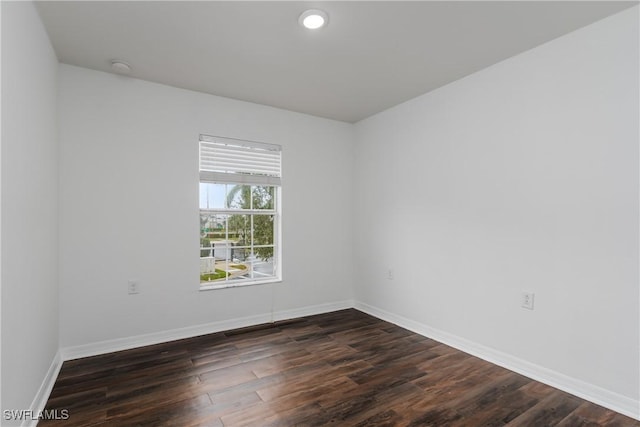 empty room featuring dark hardwood / wood-style floors