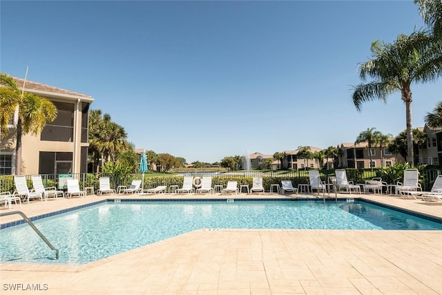 view of swimming pool featuring a patio area