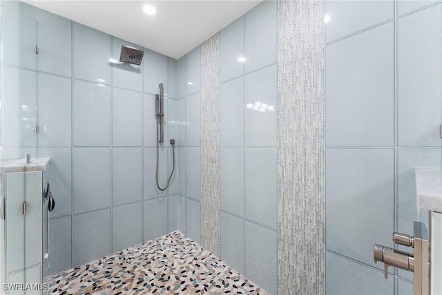 bathroom with tiled shower