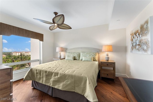 bedroom with dark wood-type flooring and ceiling fan