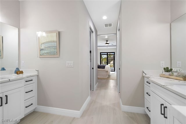 bathroom featuring vanity and ceiling fan