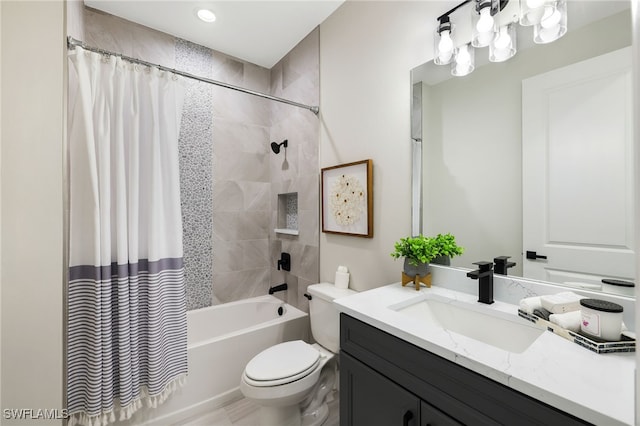 full bathroom with toilet, shower / bath combo, and vanity