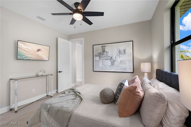 bedroom featuring light wood-type flooring and ceiling fan