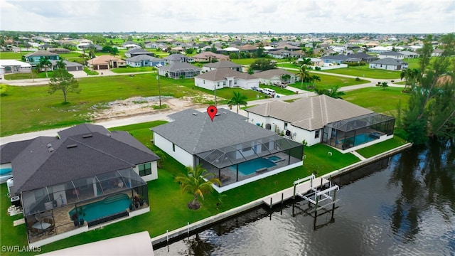 drone / aerial view with a water view